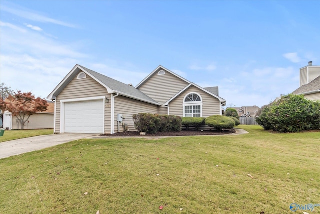 view of front of house with a garage and a front lawn