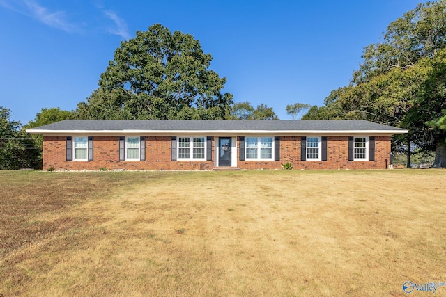 ranch-style home with a front lawn and brick siding