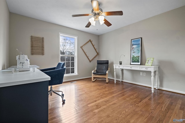 office area with wood-type flooring and ceiling fan