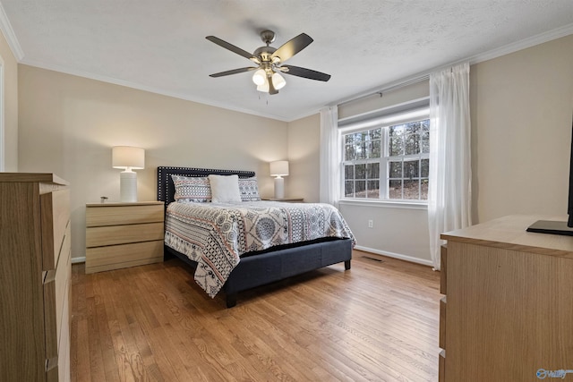 bedroom featuring hardwood / wood-style floors, crown molding, and ceiling fan