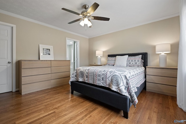 bedroom featuring wood-type flooring, ceiling fan, and crown molding