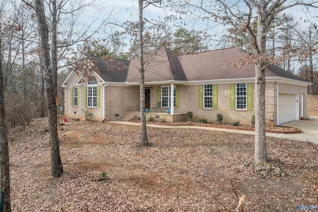 ranch-style house featuring a garage