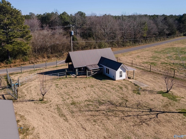 birds eye view of property with a rural view