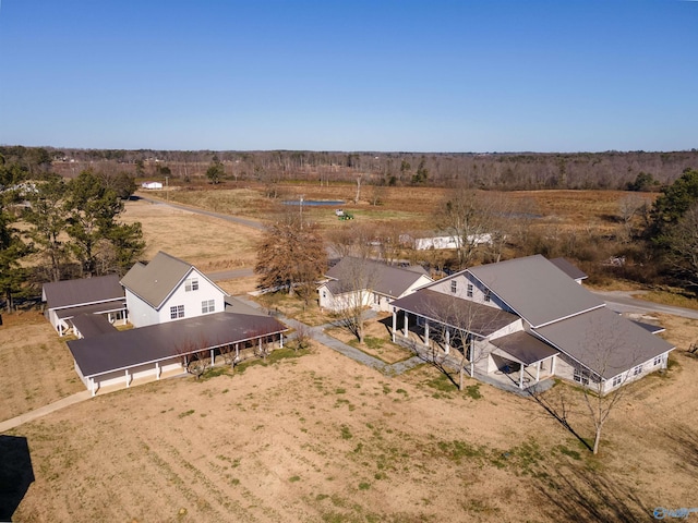 birds eye view of property with a rural view