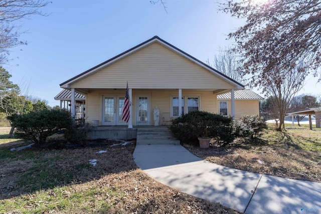 bungalow with covered porch and french doors