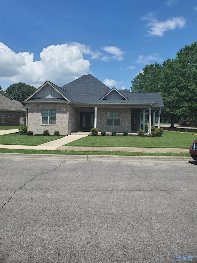 1920 Brayden Dr, Decatur, AL 35603 - view of front of home with a front yard and brick siding