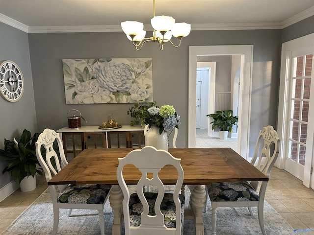 dining room with light tile patterned floors, a healthy amount of sunlight, a notable chandelier, and crown molding