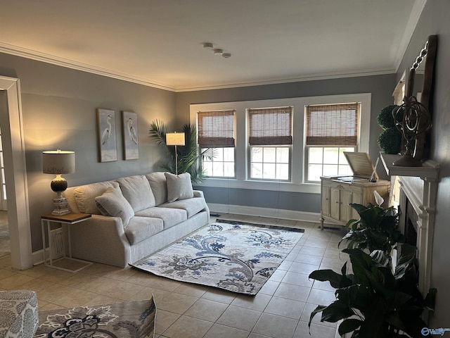 living room with ornamental molding, light tile patterned flooring, a fireplace, and baseboards