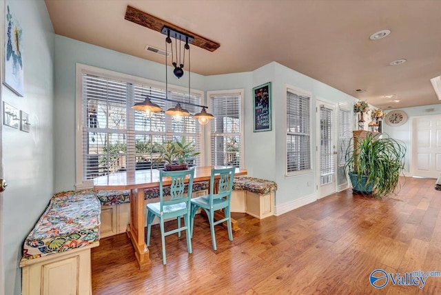 dining area with wood-type flooring