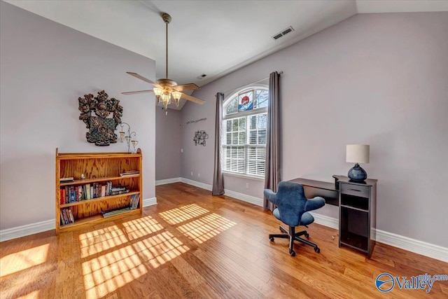 office area with ceiling fan, lofted ceiling, and hardwood / wood-style flooring