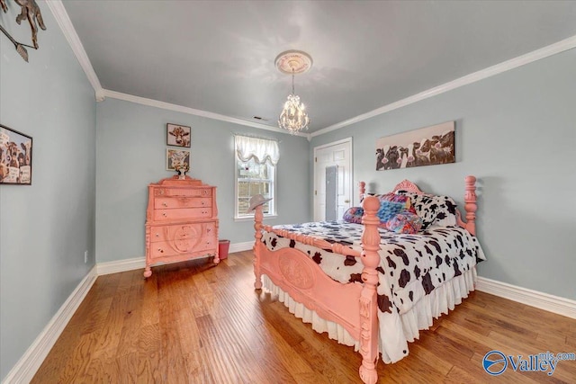 bedroom with a chandelier, crown molding, and wood-type flooring