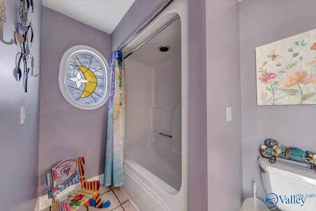 bathroom featuring shower / bath combination with curtain, toilet, and tile patterned flooring