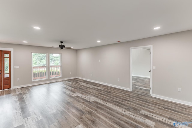 unfurnished living room with baseboards, ceiling fan, and recessed lighting