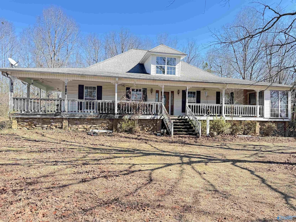 farmhouse inspired home with a porch