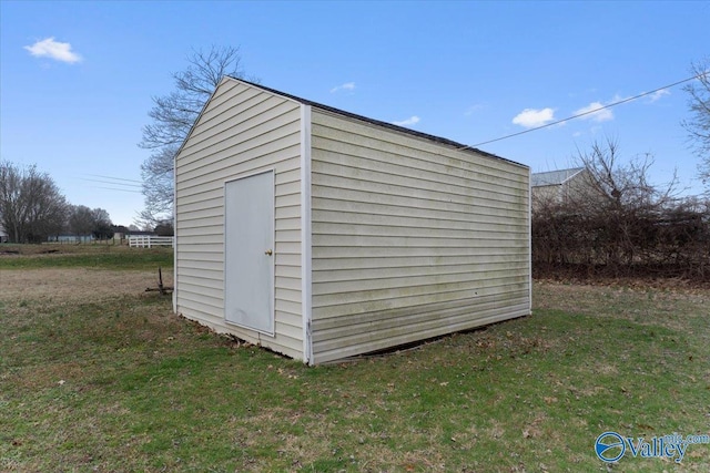 view of outdoor structure with a lawn