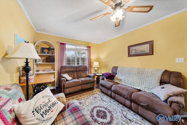 living room with hardwood / wood-style flooring, ornamental molding, ceiling fan, and a textured ceiling