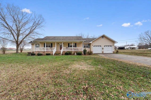 ranch-style home featuring a garage, a front yard, and a porch