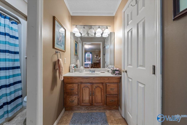 bathroom featuring curtained shower, vanity, toilet, crown molding, and a textured ceiling