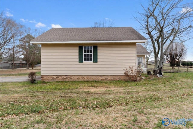 view of property exterior with a lawn