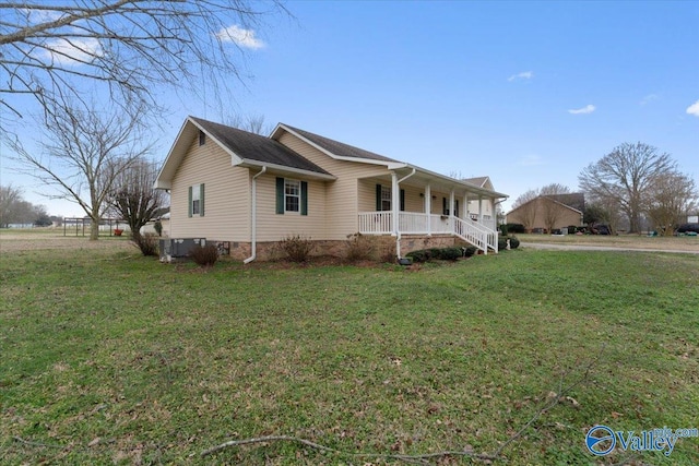 view of home's exterior featuring covered porch and a lawn