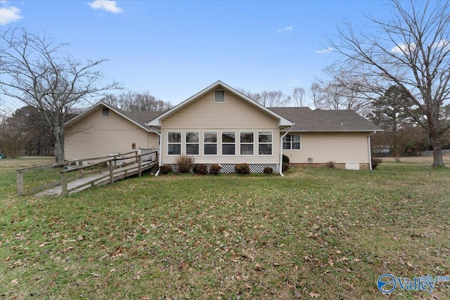 back of house with a yard