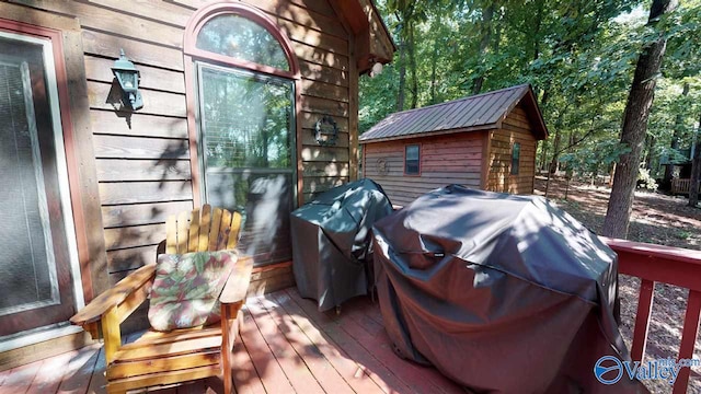 wooden terrace with grilling area