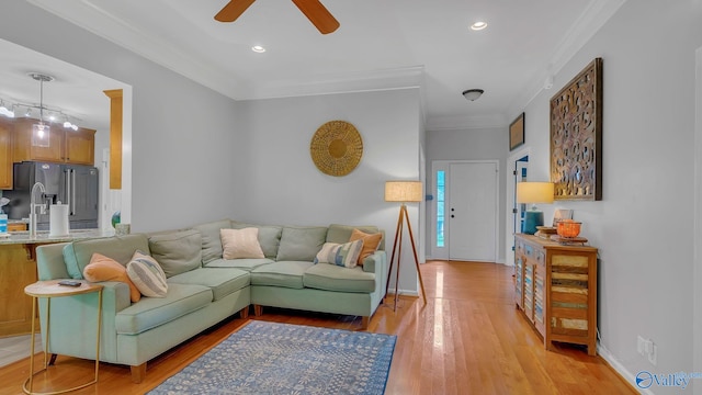 2317 Little Cove Rd, Owens Cross Roads, AL 35763 - living room with ceiling fan, ornamental molding, light wood-style floors, and recessed lighting