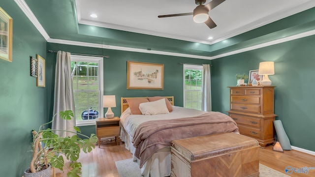 2317 Little Cove Rd, Owens Cross Roads, AL 35763 - bedroom featuring wood finished floors, a raised ceiling, crown molding, and ceiling fan
