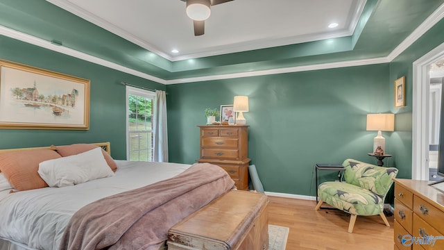 2317 Little Cove Rd, Owens Cross Roads, AL 35763 - bedroom featuring light wood-style flooring, crown molding, a ceiling fan, and a tray ceiling