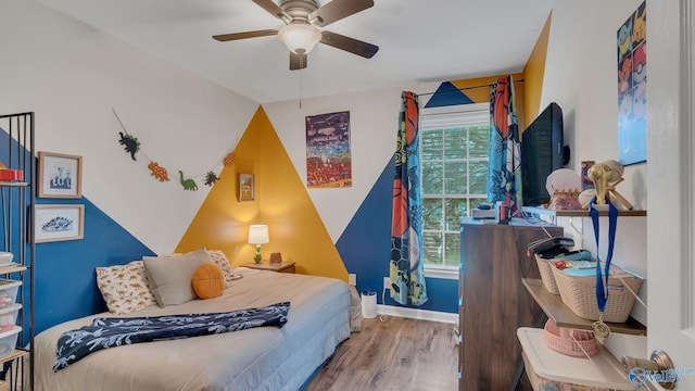 2317 Little Cove Rd, Owens Cross Roads, AL 35763 - bedroom featuring wood finished floors and a ceiling fan