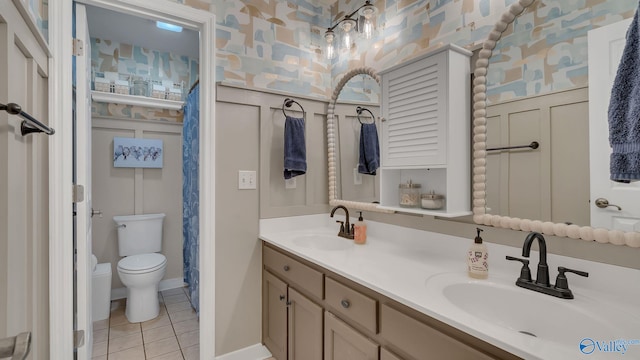 2317 Little Cove Rd, Owens Cross Roads, AL 35763 - full bath with tile patterned flooring, wallpapered walls, and double vanity
