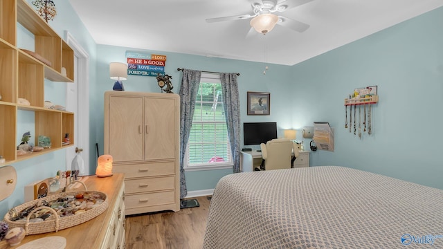 2317 Little Cove Rd, Owens Cross Roads, AL 35763 - bedroom with wood finished floors and a ceiling fan