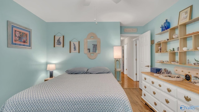 2317 Little Cove Rd, Owens Cross Roads, AL 35763 - bedroom featuring light wood finished floors and a ceiling fan