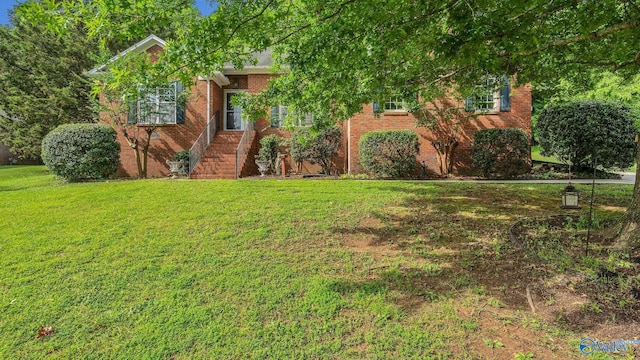 2317 Little Cove Rd, Owens Cross Roads, AL 35763 - view of front of property featuring a front lawn and brick siding