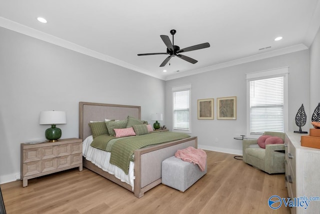 bedroom featuring light hardwood / wood-style floors, crown molding, and ceiling fan