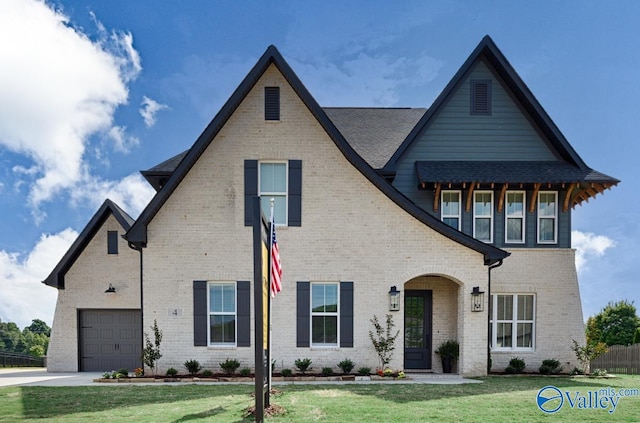 view of front facade featuring a garage and a front lawn