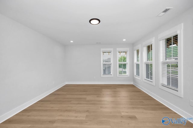 spare room featuring light hardwood / wood-style flooring