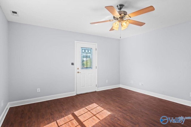 spare room featuring hardwood / wood-style floors and ceiling fan