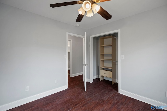 unfurnished bedroom with baseboards, a closet, a ceiling fan, and wood finished floors