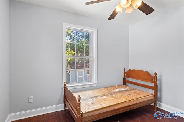 bedroom featuring dark hardwood / wood-style floors and ceiling fan