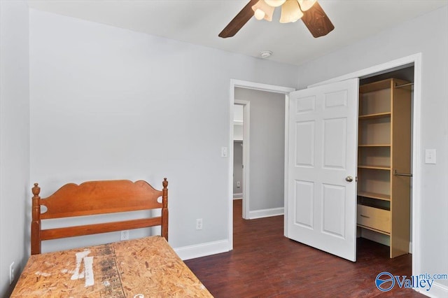 bedroom with ceiling fan, a closet, and dark wood-type flooring