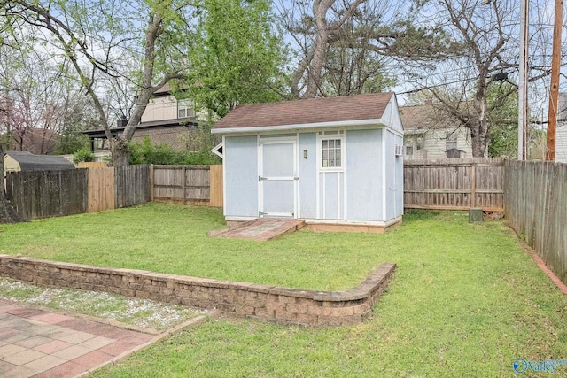 view of shed with a fenced backyard