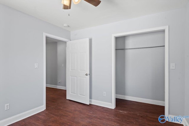 unfurnished bedroom with ceiling fan, a closet, and dark hardwood / wood-style floors