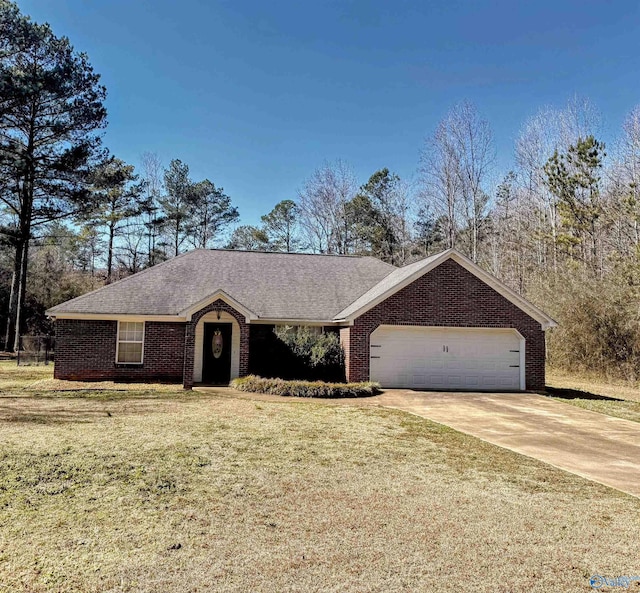 ranch-style house featuring a front lawn and a garage