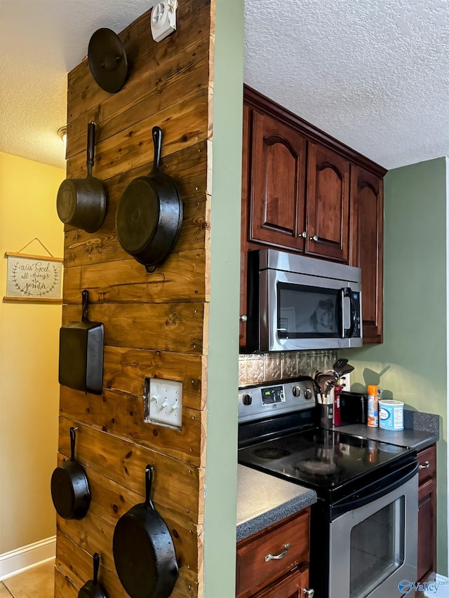 kitchen with stainless steel appliances and a textured ceiling