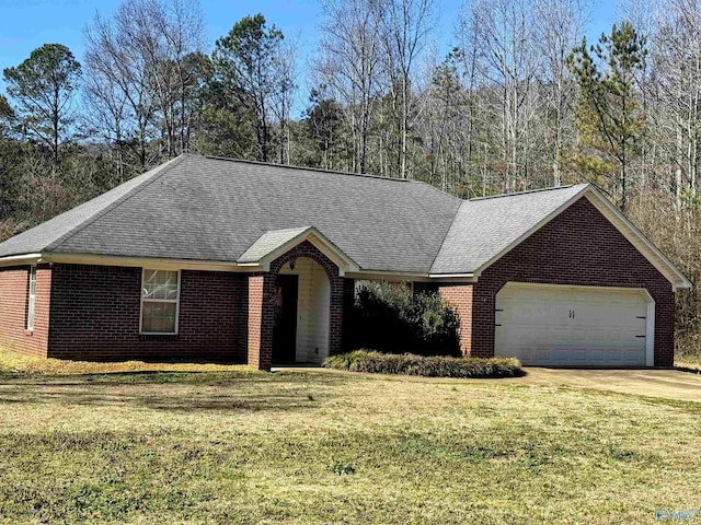 ranch-style home with a garage and a front yard