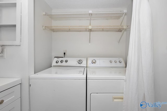 washroom with washer and dryer