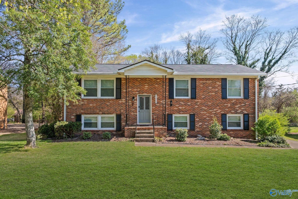 3910 Neptune Dr NW, Huntsville, AL 35810 - raised ranch with a front yard and brick siding