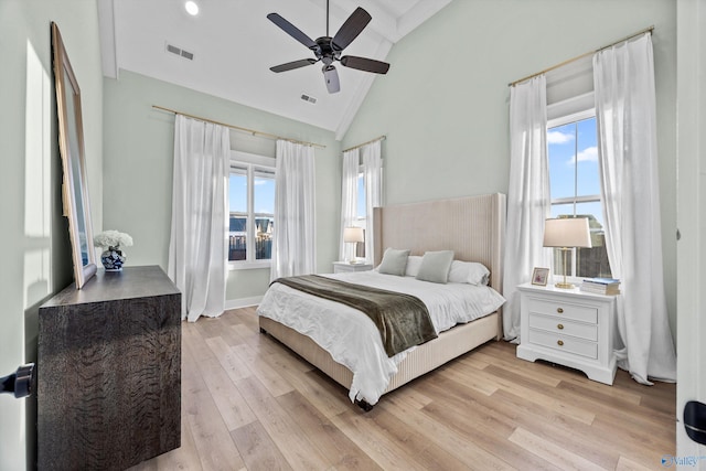 bedroom featuring light hardwood / wood-style flooring, high vaulted ceiling, and ceiling fan