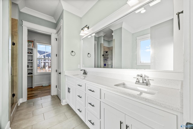 bathroom featuring vanity, plenty of natural light, an enclosed shower, and crown molding